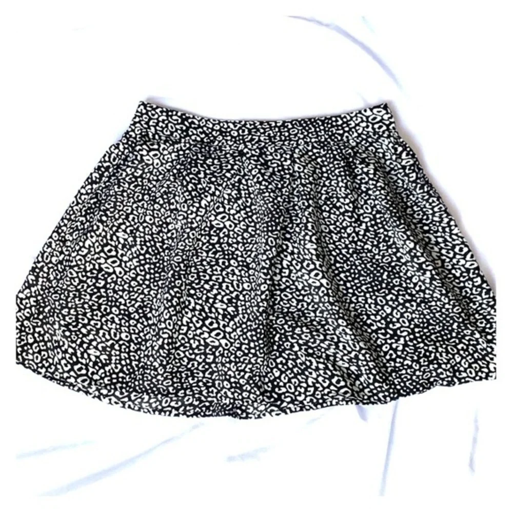 Above the knee black and white skirt